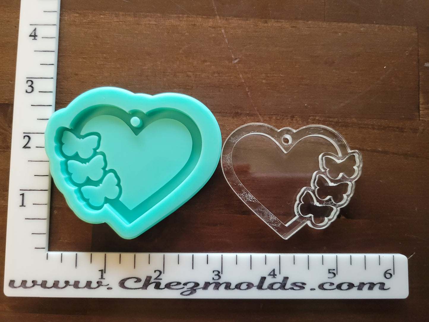 Layered heart keychain with butterfly openings