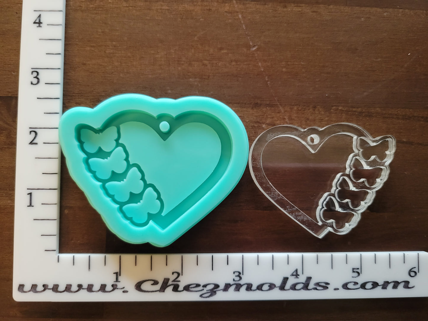 Layered heart keychain with butterfly openings